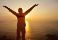 Thankful woman open arms to the sunrise Royalty Free Stock Photo
