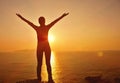 Thankful woman open arms to the sunrise Royalty Free Stock Photo