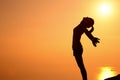 Thankful woman open arms to the sunrise Royalty Free Stock Photo