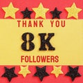 Thanks 8000, 8K followers. message with black shiny numbers on red and gold background with black and golden shiny stars