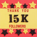 Thanks 15K, 15000 followers. message with black shiny numbers on red and gold background with black and golden shiny stars Royalty Free Stock Photo