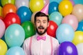 Thanks. Photo of funny guy surrounded colorful balloons surprise birthday party wear paper cone cap pink shirt bow tie Royalty Free Stock Photo