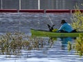 Man in small paddle boat fishes in the wetlands at Cachuma Lake, Santa Barbara County Royalty Free Stock Photo