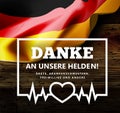 Thanks to our hero doctors, nurses, volunteers in German - Danke an unseren Helden. Vector illustration with germany flag Royalty Free Stock Photo