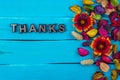 Thanks word on blue wood with flower Royalty Free Stock Photo