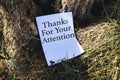 thanks for your attentions concept on white papers near trees