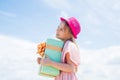 Thanks for your purchase. Joyous female kid holding gift-wrapped box. Holding gift in hand. Smiling little girl with