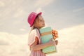 Thanks for your purchase. Joyous female kid holding gift-wrapped box. Holding gift in hand. Smiling little girl with