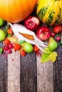 Thanksgiving background with autumn fruits and gourds on a rustic wooden table. Autumn harvest. Top view. Copy space. Thanksgiving Royalty Free Stock Photo