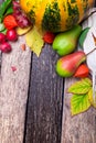 Thanksgiving background with autumn fruits and gourds on a rustic wooden table. Autumn harvest. Top view. Copy space. Thanksgiving Royalty Free Stock Photo