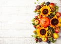 Thanksgiving background with autumn pumpkins, fruits and flowers