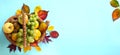 Thanksgiving background; basket with autumn fresh Fruit and autumn leaves