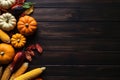 Thanksgiving background corn cob, pumpkins and fallen leaves on a dark wooden table. banner with copy space for text. Halloween, Royalty Free Stock Photo