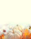 Thanksgiving background. Wooden table, decorated with pumpkins, autumn leaves and candles