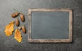 Thanksgiving card with oak leaves, acorns and chalk board