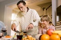 Thanksgiving Celebration Tradition Family Dinner Concept. family having holiday dinner and cutting turkey. Old handsome Royalty Free Stock Photo