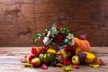 Thanksgiving centerpiece with snowberry and rowan berries in glass vase, copy space Royalty Free Stock Photo