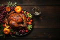 Thanksgiving or Christmas dinner with roasted turkey, glass of wine and fruits on rustic wooden table. Top view with copy space