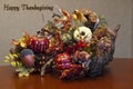 Thanksgiving cornucopia arrangement plus sign Royalty Free Stock Photo