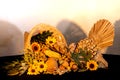 Thanksgiving cornucopia centerpiece with sunflowers and turkey celebrating fall autumn harvest holiday, seasonal symbols of plenty