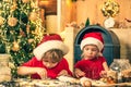 Thanksgiving day and Christmas for children. Two cute boys with santa hat. Merry Christmas. Christmas food and drink Royalty Free Stock Photo