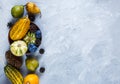 Thanksgiving day composition of vegetables and fruits on gray background. Autumn harvest concept. Pumpkins, pears, plums Royalty Free Stock Photo