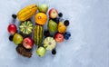 Thanksgiving day composition of vegetables and fruits on gray background. Autumn harvest concept. Royalty Free Stock Photo