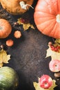 Thanksgiving day concept. Autumn table setting for dinner with plate, knife, fork decorated pumpkins and maple leaves. Flat lay Royalty Free Stock Photo