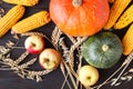 Thanksgiving Day concept - border or frame with orange pumpkins and colourful leaves on wooden background Royalty Free Stock Photo