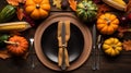 Thanksgiving day concept. Top view photo of table setting plate knife fork napkin raw vegetables pumpkins isolated dark wooden,