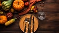 Thanksgiving day concept. Top view photo of table setting plate knife fork napkin raw vegetables pumpkins isolated dark wooden, Royalty Free Stock Photo
