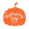 Thanksgiving Day hand lettering on brush stroke orange pumpkin. Thanksgiving holiday greeting card.