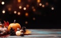 Thanksgiving day with pumpkins, pine cone and maple leaves on dark bokeh lights background. Autumn composition with copy space.