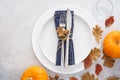 Thanksgiving Day table setting with leaves and pumpkins Royalty Free Stock Photo