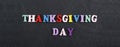 THANKSGIVING DAY word on black board background composed from colorful abc alphabet block wooden letters, copy space for ad text. Royalty Free Stock Photo