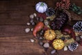 Thanksgiving decor with frosted pine cones and sunflowers, Royalty Free Stock Photo