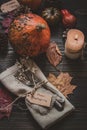 Thanksgiving decoration with cutlery and napkin on the wooden table.