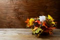 Thanksgiving decoration with silk fall leaves on rustic background Royalty Free Stock Photo