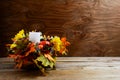 Thanksgiving decoration with silk leaves on rustic background Royalty Free Stock Photo