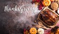 Thanksgiving dinner background concept with turkey roasted and all sides dishes, fall leaves, pumpkin and seasonal autumnal decor