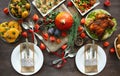 Thanksgiving dinner with family. Flat table with various dishes and seasonal vegetables, top view. Table setting in autumn style