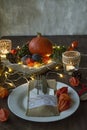 Thanksgiving dinner. Halloween dinner. Festive table with chicken and all side dishes, pumpkin, autumn leaves and seasonal autumn