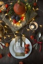 Thanksgiving dinner. Halloween dinner. Festive table with chicken and all side dishes, pumpkin, autumn leaves and seasonal autumn