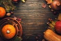 Thanksgiving dinner place setting. Autumn fruit, pumpkins, nuts, fallen leaves with plate and cutlery. Thanksgiving autumn Royalty Free Stock Photo