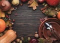 Thanksgiving dinner place setting. Autumn fruit, pumpkins, nuts, fallen leaves with plate and cutlery. Thanksgiving autumn Royalty Free Stock Photo