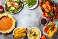 Thanksgiving dinner table with roasted whole chicken or turkey, green beans, mashed potatoes, cranberry sauce, grilled vegetables Royalty Free Stock Photo