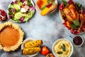 Thanksgiving dinner table with roasted whole chicken or turkey, green beans, mashed potatoes, cranberry sauce, grilled vegetables Royalty Free Stock Photo