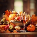 thanksgiving dinner table with wine glass grapes and pumpkins
