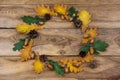 Thanksgiving door wreath with green and yellow oak leaves, acorns and pine cones