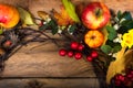 Fall wreath with pumpkins, apples, white red berries Royalty Free Stock Photo